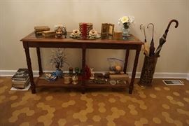 vintage Glass top table with wicker bottom, toby mug, marble cigarette holder and lighter, decorative boxes, Umbrella holder and umbrellas