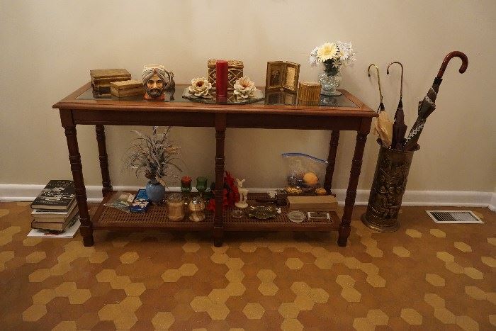 vintage Glass top table with wicker bottom, toby mug, marble cigarette holder and lighter, decorative boxes, Umbrella holder and umbrellas 