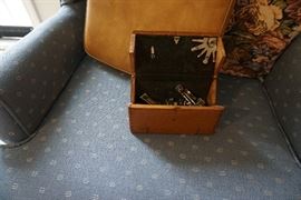 folding box with sewing machine parts.