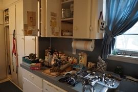 Kitchen items, cupboards are full