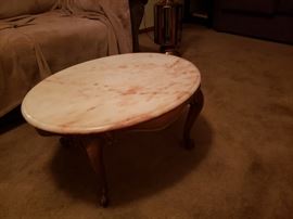 Small oval coffee table with marble top