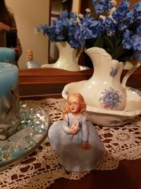 Ceramic figurine with bowl and pitcher