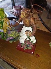 Monket Fugurine with Grapes on Leaves