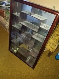 Curio cabinet with mirrored back