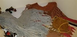 Two fringed leather vests 