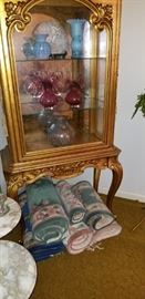 Gilded antique curio cabinet and several carpets