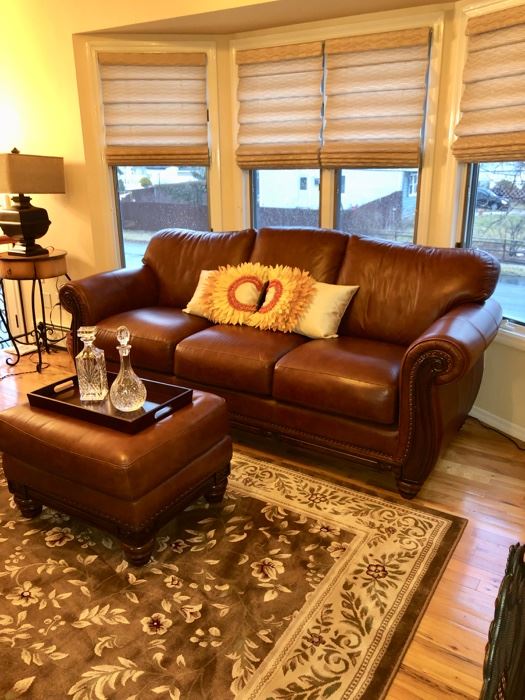 Like new leather sofa with matching oversized chair & ottoman & area rugs