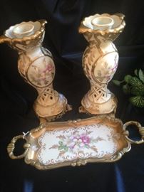 Elegant three-piece set of candle holders and tray