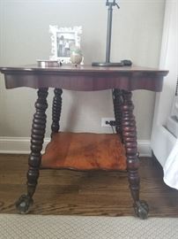 Antique side table with talon carved feet, scalloped edge	27sq x 28.5h