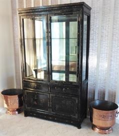 Black lacquer curio cabinet. Copper planters