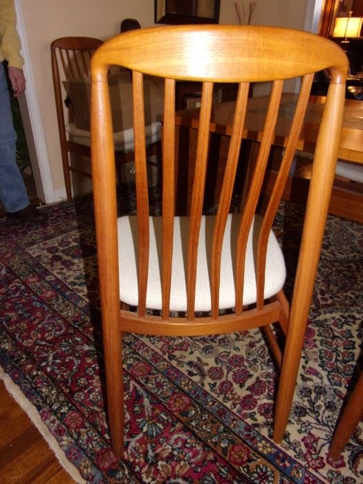 Beautiful vintage Benny Linden Danish MCM teak chairs (6 chairs plus 2 captains). Drop-down dining room table with stone tile inlay.