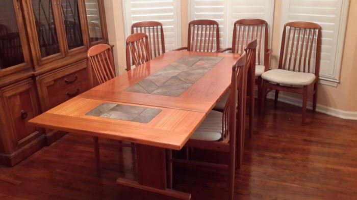 Beautiful vintage Benny Linden Danish MCM teak chairs (6 chairs plus 2 captains). Drop-down dining room table with stone tile inlay.