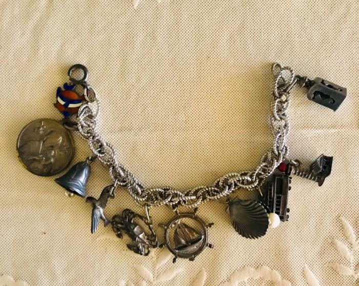 Vintage sterling charm bracelet with 10 charms