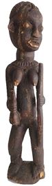 African Female Figure
Wood
Early to mid 20th century
35"
Bamileke/ Cameroon Grassfields; has characteristic protruding ears and eyes, filed teeth, rounded shoulders and back of head, and is carrying a ritual calabash