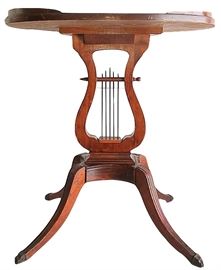 One of a pair of 23” tall oval lyre tables by Lexington Chair