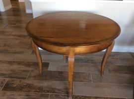 Round table that folds to half table