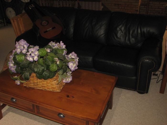 Green leather sofa with brass nailheads, pine coffee table