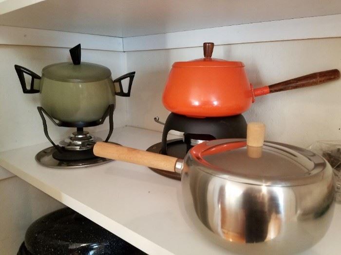 Lots of various fondue pots. 