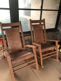 Porch rockers, all wood with woven seats under the vinyl covering 
