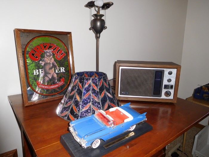 Grizzly light mirror, Magnavox radio, Cadillac Eldorado model car, tiffany lamp that needs a little TLC