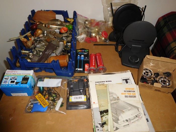Vintage car manuals, tv antennas, bottle openers