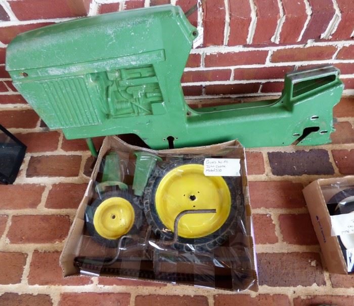 John Deere toy tractor parts with closed block