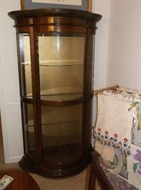 Bow front curio cabinet and lots of crocheted doilies