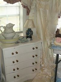 Small white paint serpentine front chest and vintage wedding gown
