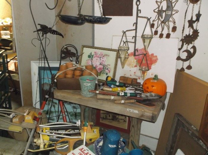 Wind chimes, bird feeders, potting table