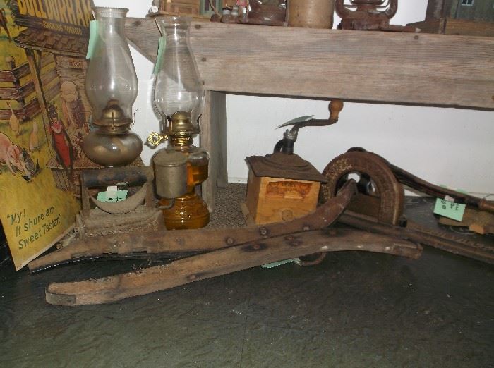 Oil lamps, coffee grinder, tobacco cutter, mule hames