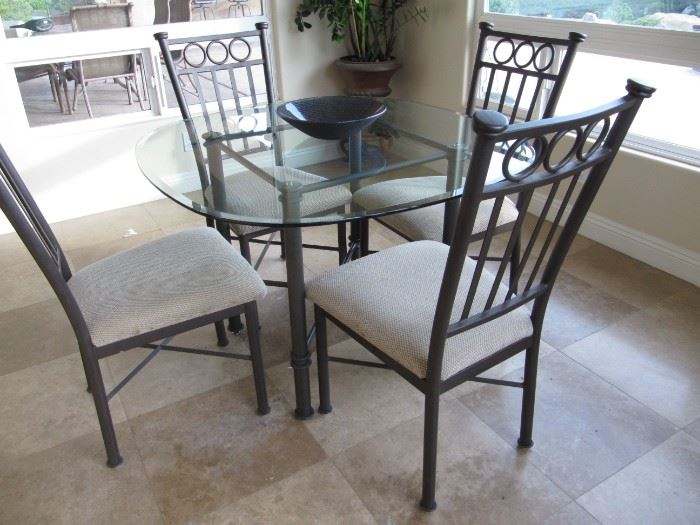 Iron and glass dining table with four chairs