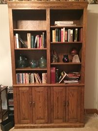 Hand crafted solid oak book shelf with hand blown glass sculptures, assorted books and book ends