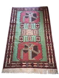 Rare finely woven, hand knotted Kilim rug. Gorgeous green, red and ivory tones will add dimension and elegance to any decor. The tightly woven silk thread add sheen and beauty to the geometric design