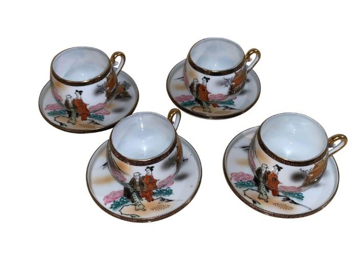 Unusual Moriage Japanese Lithophane Geigha cup and saucer, tea Cups and saucers set for 4.  Fine detail and paper thin porcelain. When you hold up the bottom of the tea cup to the light, a hologram of a woman's face appears. Fine quality and detailing. A must have and conversation piece for any collector