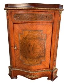 Beautiful tone and brass trim, one door commode.Inlay accent and trim add character for the perfect display item
