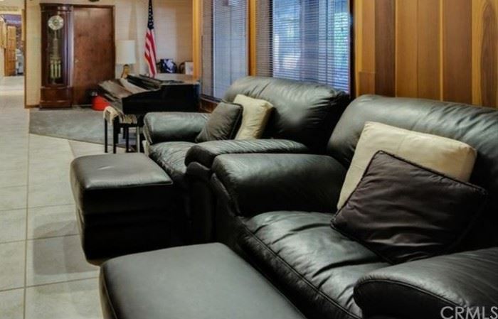 Black leather chairs with Ottomans.
Ridgeway grandfather clock.