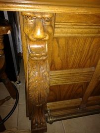 English oak bar carved Lions faces.