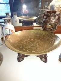 Chinese brass plate on stand.