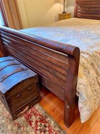 Queen sized sleigh bed with Pottery Barn bedding