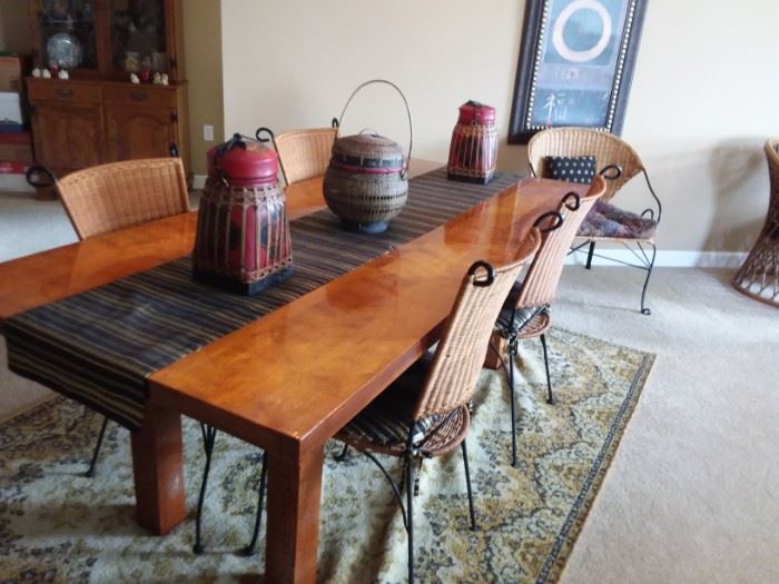 Stunning rustic all wood dining room table and 4 metal/wicker chairs with Asian inspired cushions.