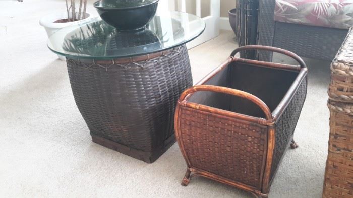 Wicker basket with glass top end table and bamboo basket with handles.