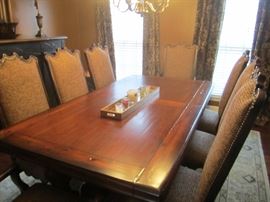 VERY NICE TABLE WITH 2 LEAVES AND 2 ARM AND 6 SIDE CHAIRS FROM OOH LA LA