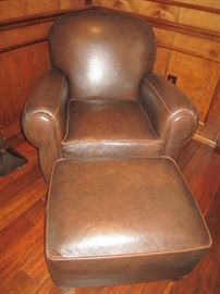 BROWN LEATHER CHAIR AND OTTOMAN