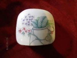 Decorative box. Appears to be porcelain lid on top of metal box.