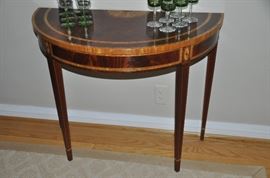 Spectacular flame mahogany with inlay design Demi-lune table by Councill Craftsman , 35”w x 29”h x 16”d