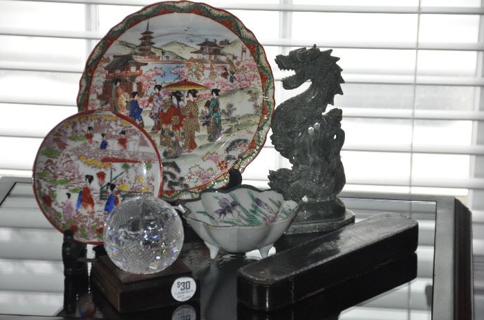 Beautiful fine porcelain Asian plates and bowl as well as a carved marble dragon and a Waterford crystal world globe. 