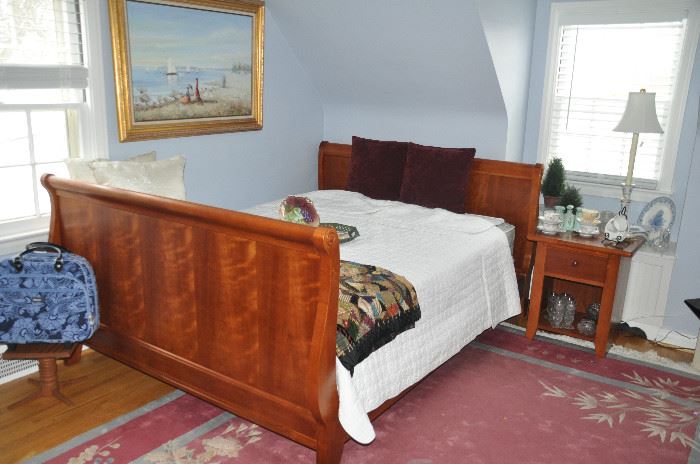 Wonderful bedroom complete with a cherry queen size sleigh bed headboard and foot board by Thomasville. Sealy Carlisle mattress and box springs sold separately