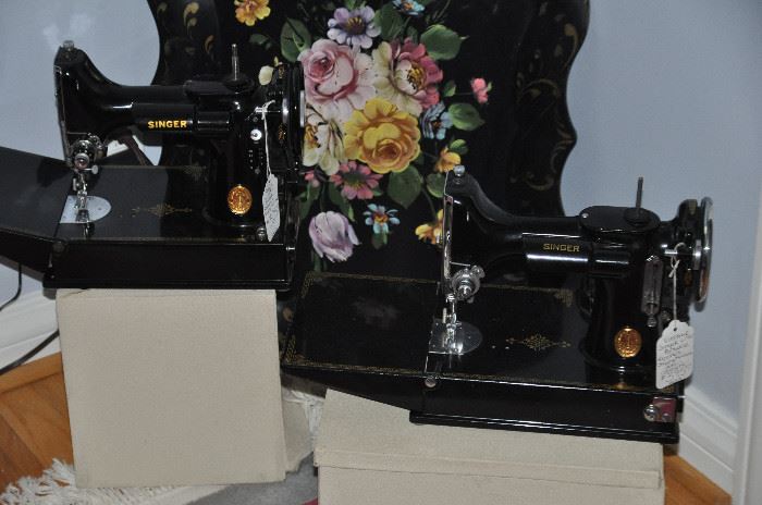 Two vintage Singer Portable Sewing Machines available with original cases and a large vintage black tole painted tin tray.