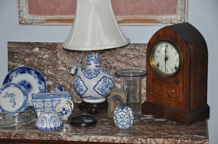 Lovely blue and white porcelain pieces including B &C Royal Blue and Delft as well as an antique etched tin picture frame and an antique nonworking Sessions Mantle Clock by E. N. Welsh Mfg. Co. 