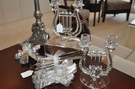 Pair of vintage Fostoria "lyre" candlesticks shown with a service for 10 Reed and Barton vintage silver-plate flatware set